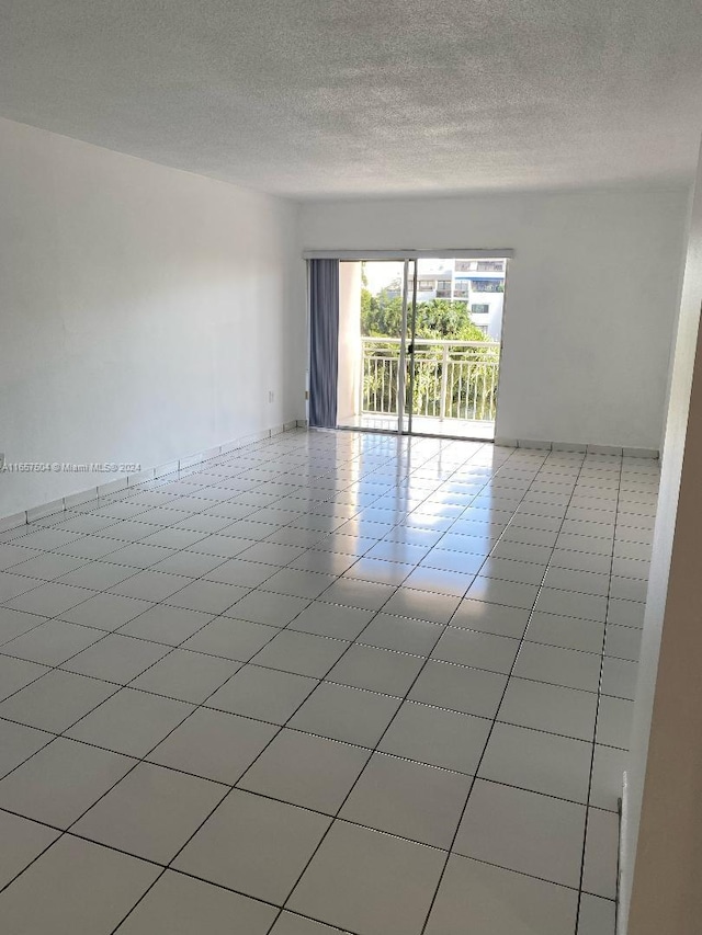 empty room with a textured ceiling
