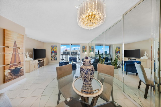 dining room with expansive windows, light tile patterned flooring, an inviting chandelier, and a textured ceiling