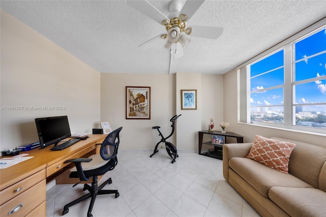 office with a textured ceiling and ceiling fan