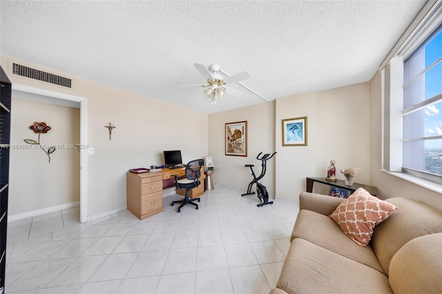 office space featuring a textured ceiling and ceiling fan