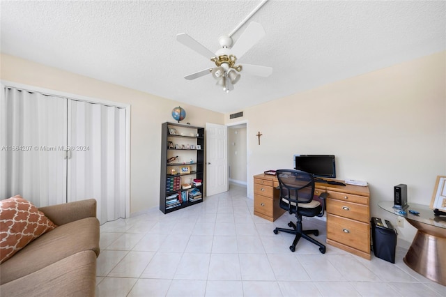 office featuring ceiling fan and a textured ceiling