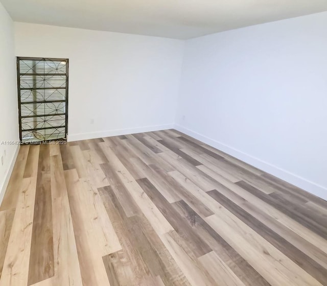 unfurnished room featuring light wood-type flooring