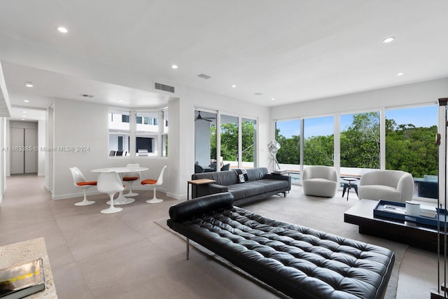 325 Campana Ave, Coral Gables, FL 33156 - living area with healthy amount of natural light, recessed lighting, and baseboards