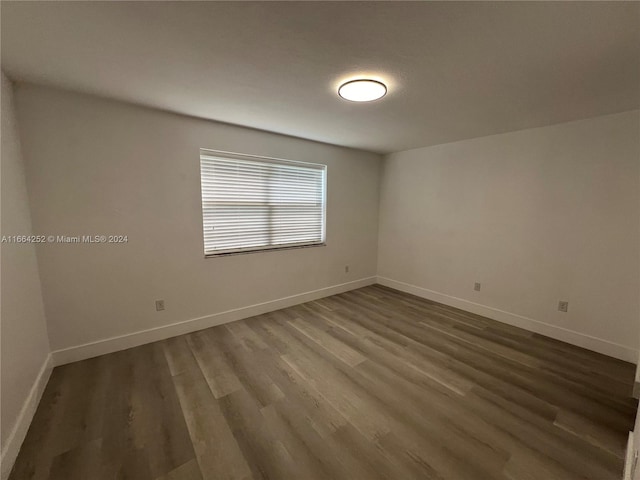 spare room featuring hardwood / wood-style flooring