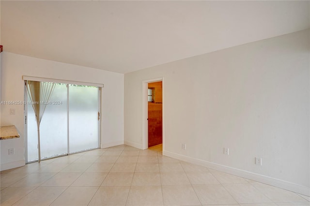 unfurnished bedroom featuring a closet and light tile patterned floors