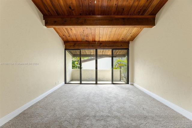 empty room with beamed ceiling, carpet, and wooden ceiling