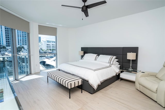 bedroom featuring ceiling fan and access to outside