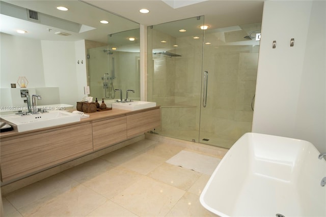 bathroom with a stall shower, visible vents, a sink, and double vanity