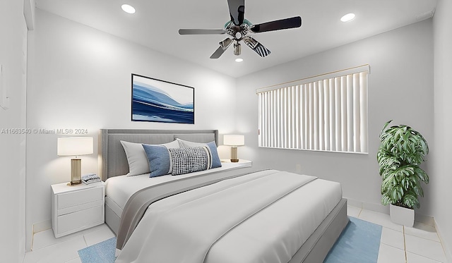 bedroom featuring ceiling fan and light tile patterned floors