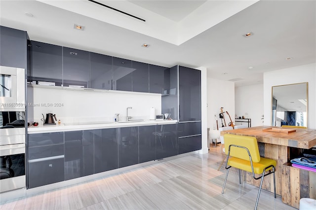 kitchen with light wood-type flooring and sink