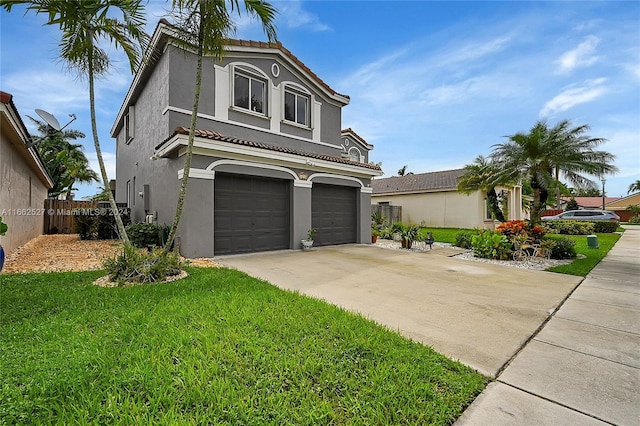 view of front of house with a front yard and a garage