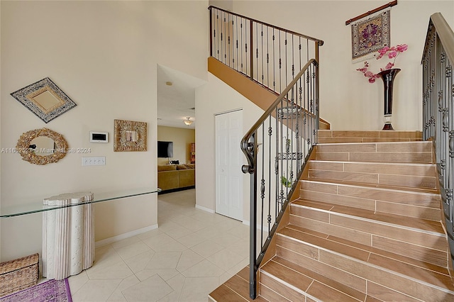 stairs with tile patterned floors