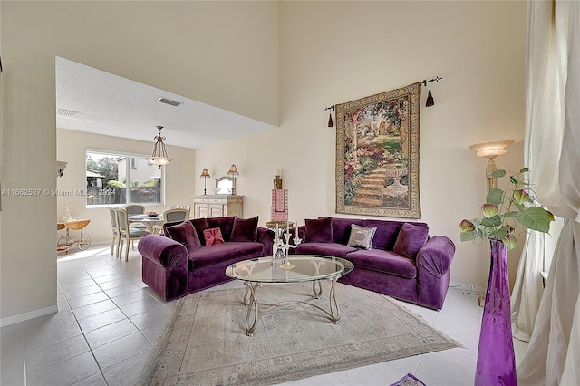 tiled living room with a textured ceiling