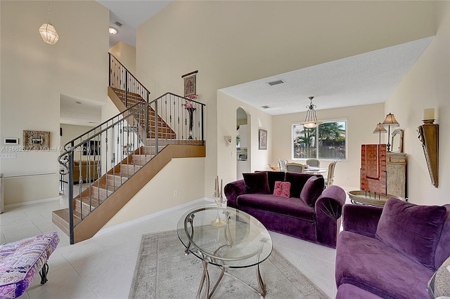 tiled living room with a textured ceiling