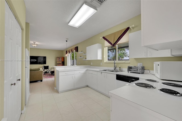 kitchen featuring sink, kitchen peninsula, white appliances, decorative light fixtures, and white cabinetry