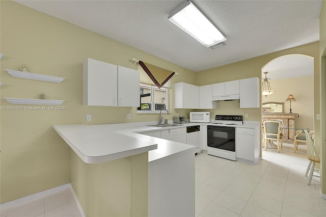 kitchen with a textured ceiling, sink, white cabinets, kitchen peninsula, and white appliances