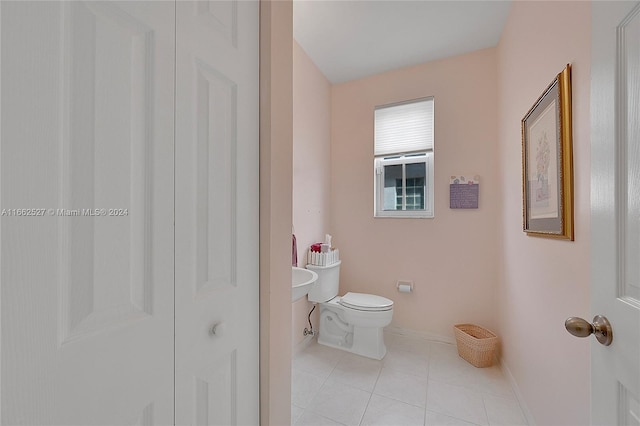 bathroom featuring tile patterned flooring and toilet