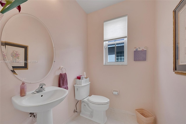 bathroom with tile patterned flooring and toilet