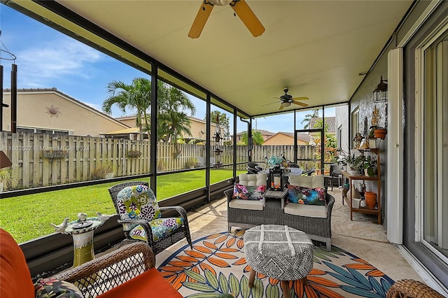 sunroom featuring ceiling fan