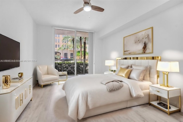 unfurnished bedroom with ceiling fan, multiple closets, a textured ceiling, and light hardwood / wood-style flooring