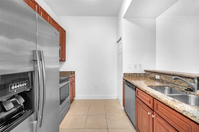 kitchen featuring stone counters, crown molding, sink, and stainless steel dishwasher