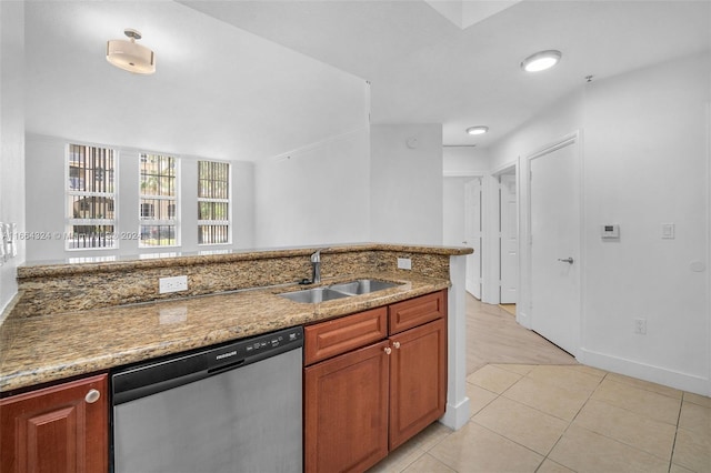 laundry area with light tile patterned flooring, electric panel, and stacked washer and dryer