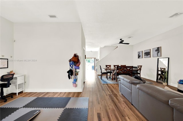 living room with hardwood / wood-style flooring and ceiling fan