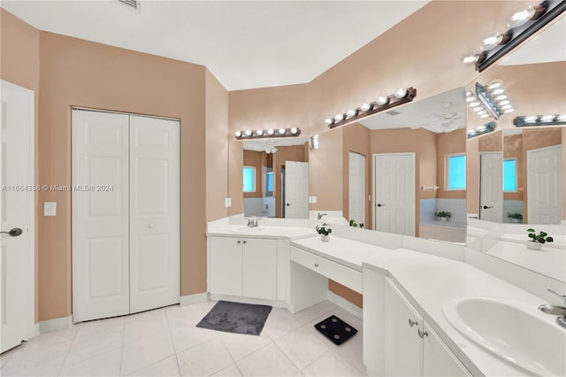 bathroom with tile patterned flooring, vanity, and ceiling fan