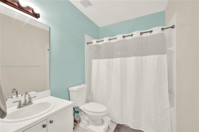 bathroom featuring tile patterned floors, a shower with curtain, vanity, and toilet