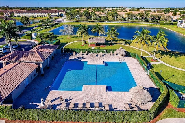 view of swimming pool with a water view