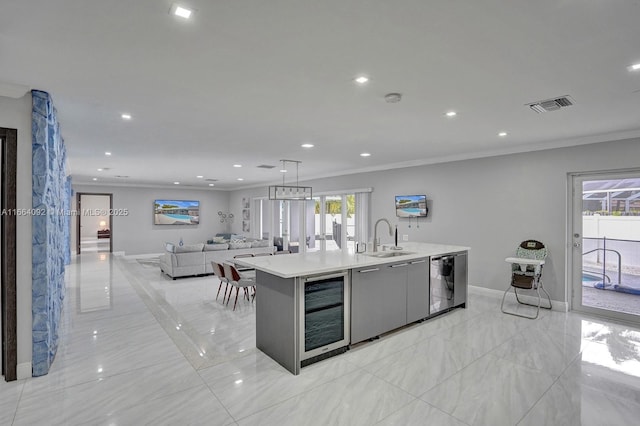 kitchen featuring visible vents, a sink, stainless steel dishwasher, wine cooler, and crown molding