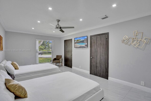 bedroom with ornamental molding and ceiling fan