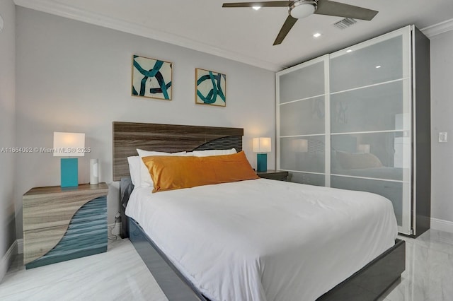 bedroom featuring ceiling fan, baseboards, and ornamental molding