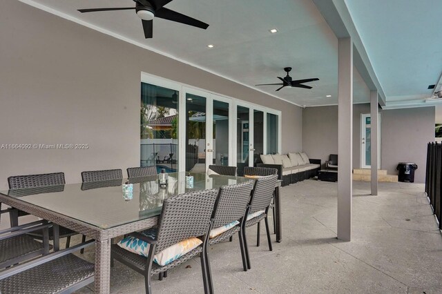 view of pool with a patio and ceiling fan