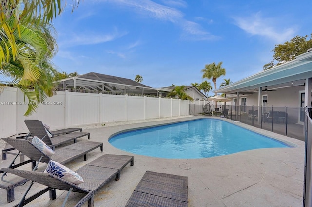 view of pool featuring a fenced backyard, a fenced in pool, a patio, and ceiling fan