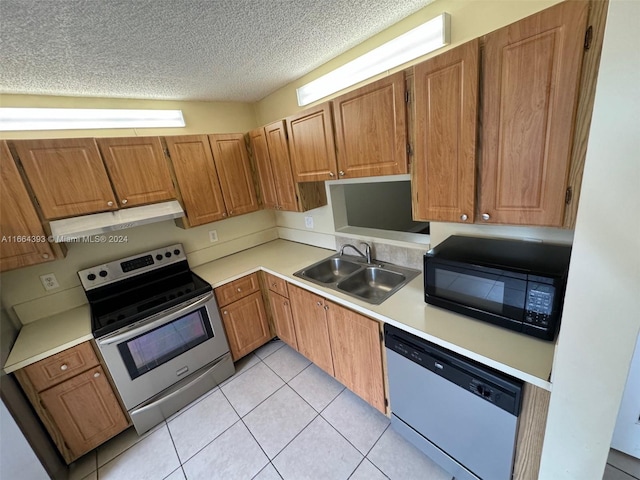 kitchen featuring light tile patterned floors, sink, stainless steel electric range, a textured ceiling, and dishwashing machine