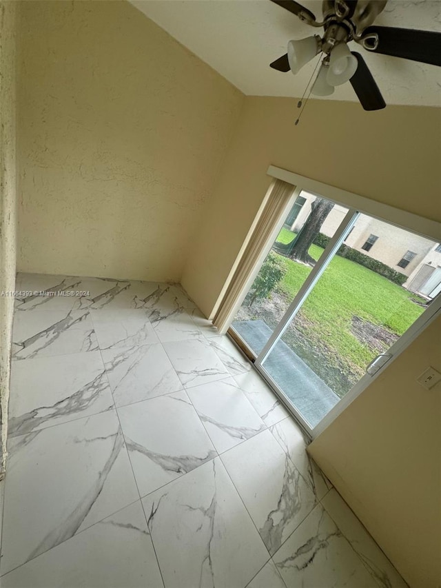 interior space featuring ceiling fan