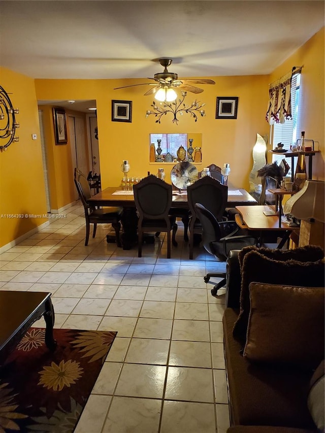 dining room with light tile patterned floors and ceiling fan