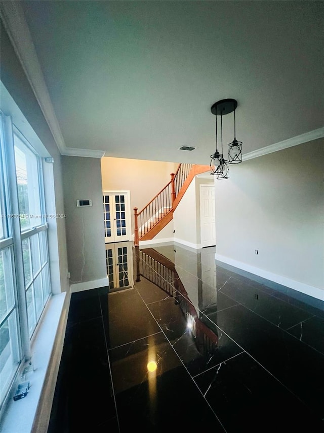 interior space with an inviting chandelier and crown molding