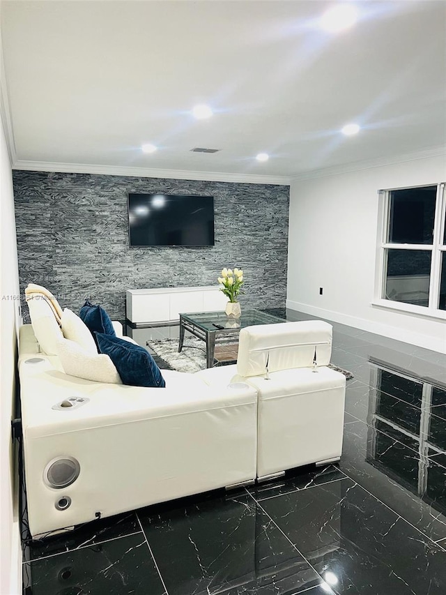 living room featuring crown molding, a fireplace, and tile walls