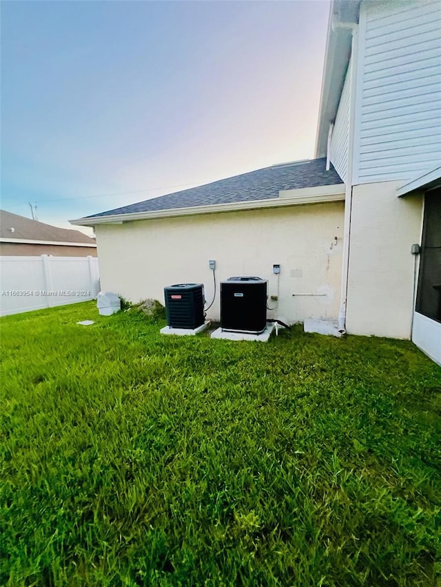 view of yard with central air condition unit