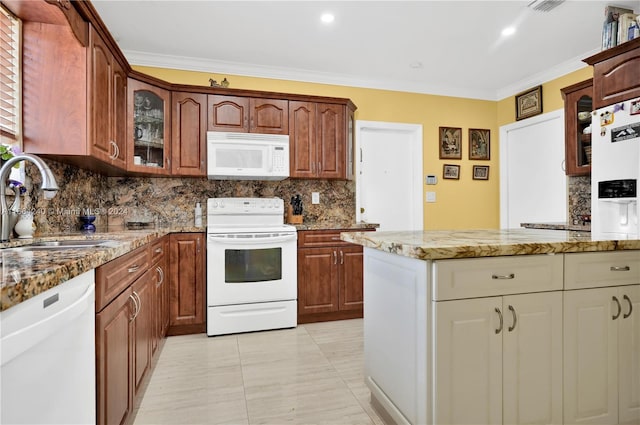 kitchen with white appliances, ornamental molding, sink, and light stone counters