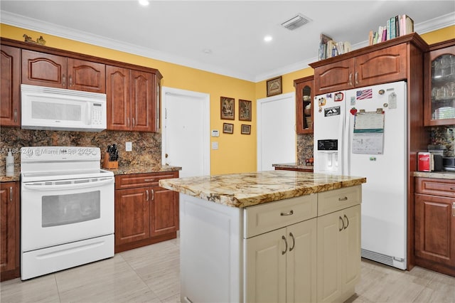 1407 San Marco Ave, Coral Gables, FL 33134 - kitchen with visible vents, glass insert cabinets, a center island, white appliances, and backsplash