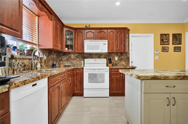 kitchen featuring sink, ornamental molding, white appliances, backsplash, and light stone countertops