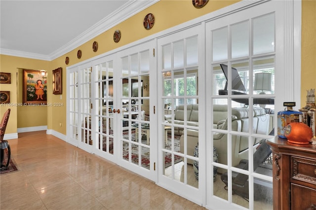 doorway with light tile patterned flooring, ornamental molding, and french doors