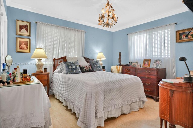 bedroom featuring crown molding, light tile patterned flooring, and an inviting chandelier