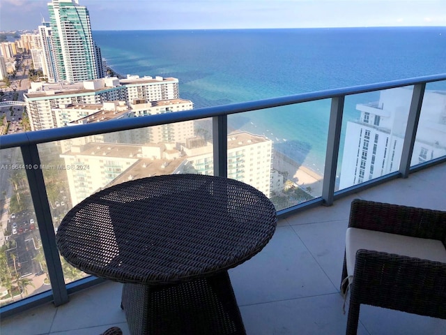 balcony featuring a water view