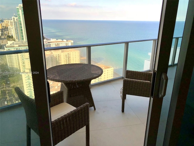 balcony featuring a water view