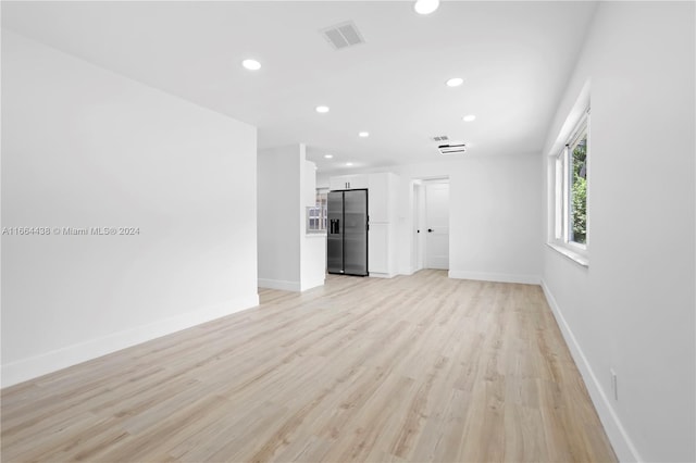 unfurnished living room featuring light hardwood / wood-style flooring