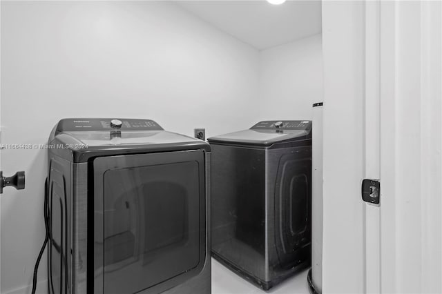 washroom with independent washer and dryer